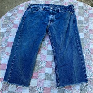 Levi’s 505 jeans. Legs cut short, but no holes or tearing seems
